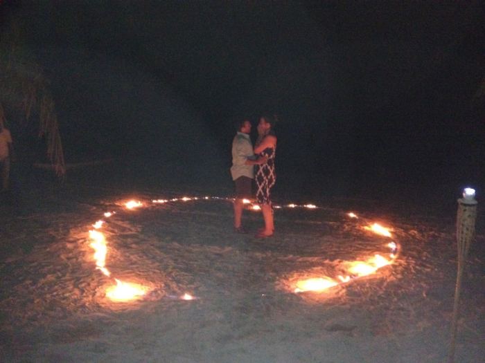 A proposal in a ring of candles on the sand